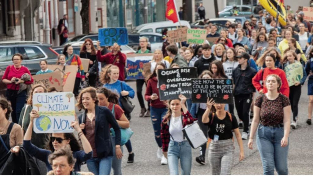 Large group of people protesting for climate change action